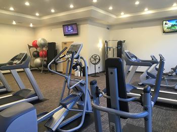 A room filled with furniture and a flat screen tv